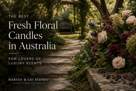 Fresh floral candle inspiration featuring a lush garden pathway with roses, greenery and botanical elements for luxury home fragrance by Harvey & Co. Sydney®
