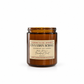 An amber glass jar candle with a cream label reading 'Harvey & Co. Sydney Cinnamon Scroll' on a clean white background.