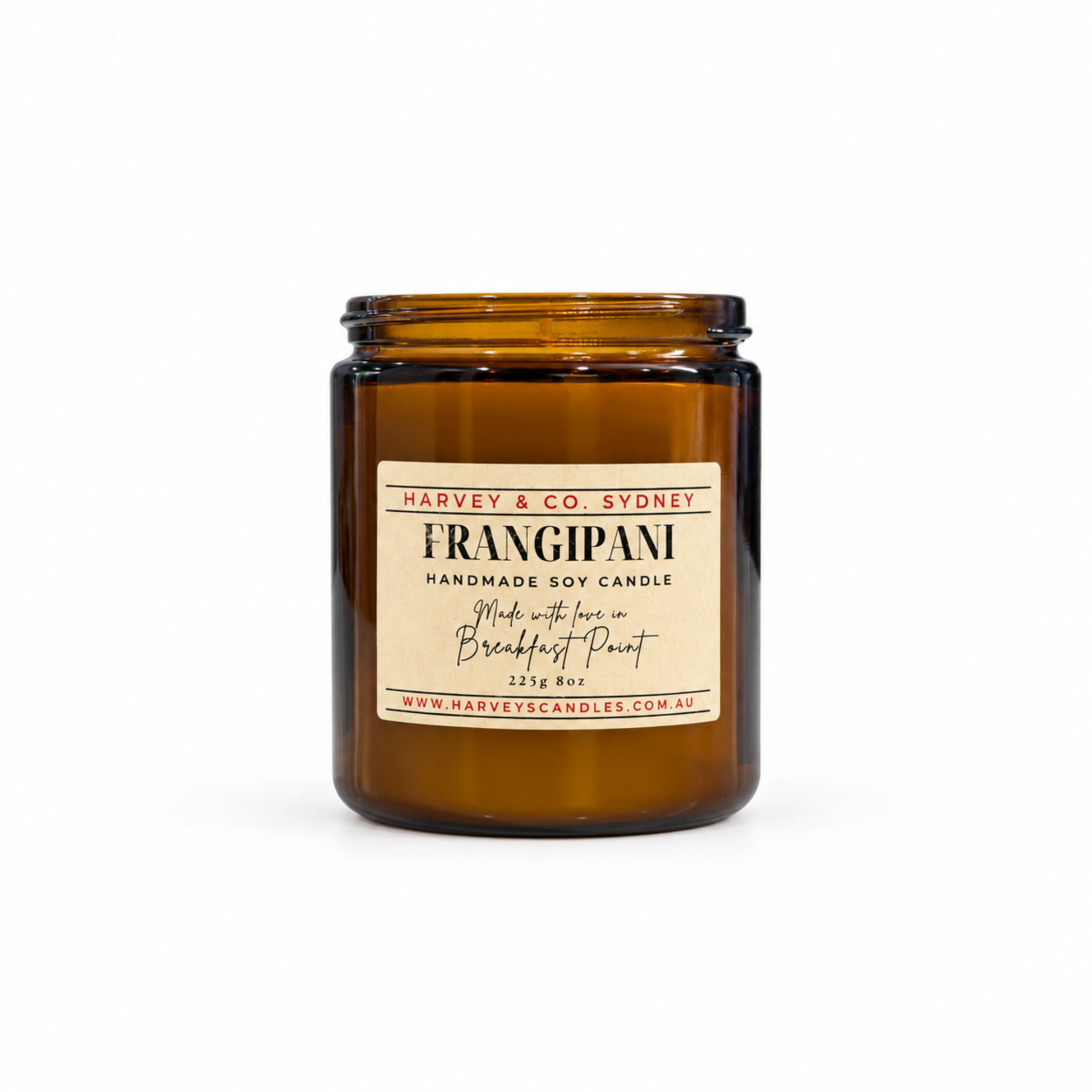 Harvey & Co. Sydney Frangipani handmade soy candle in an amber glass jar on a white background.