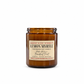 An amber glass jar candle with a cream label reading 'LEMON MYRLE' and 'Harvey & Co. Sydney', photographed on a clean white background.