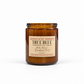 An amber glass jar candle with a beige paper label reading 'TRUE BLUE HANDMADE SOY CANDLE' and 'Harvey & Co. Sydney' at the top, photographed on a clean white background.