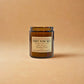 Candle jar labeled 'Three Wise Men' on a beige background