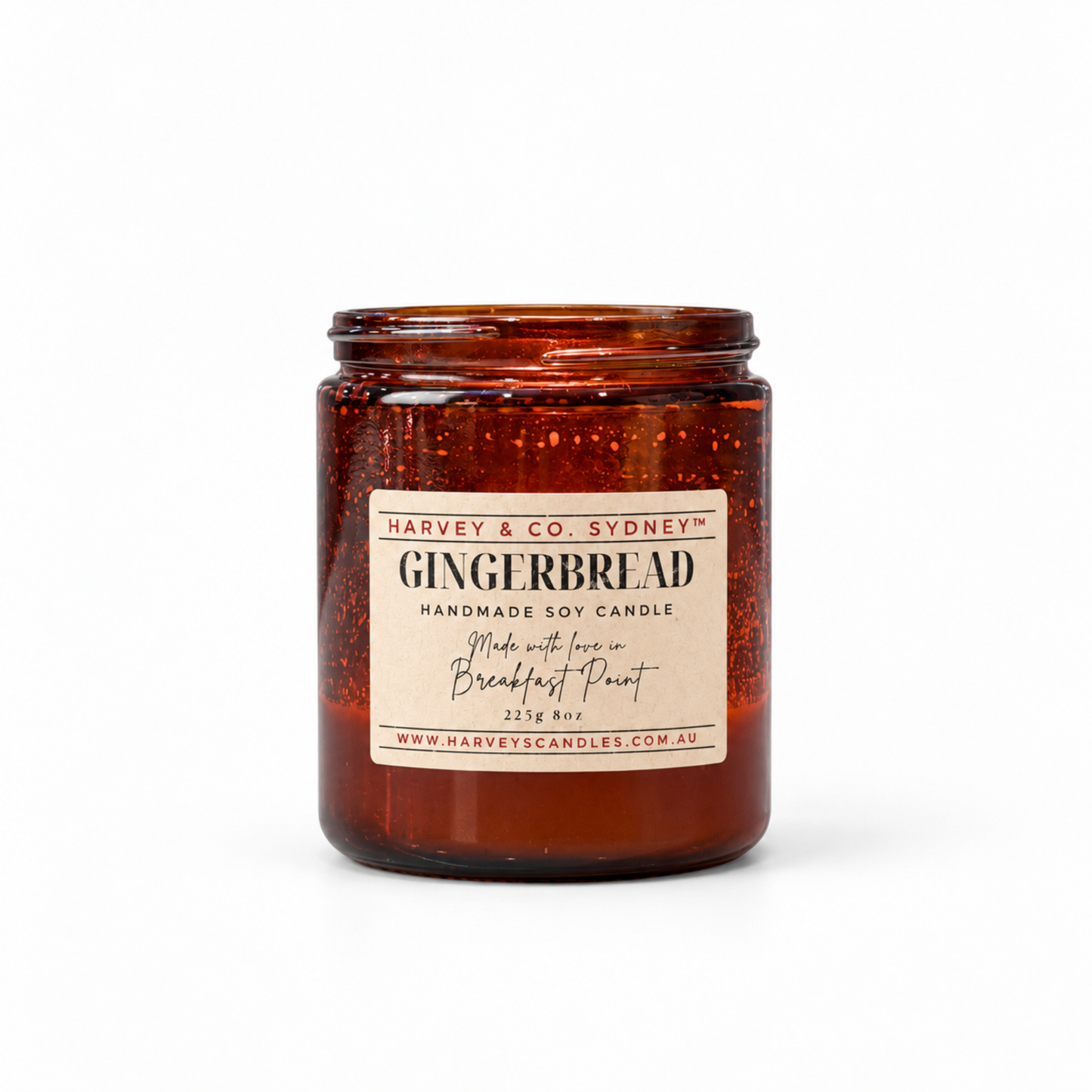     Harvey & Co. Sydney Gingerbread soy candle in a reddish amber glass jar with a cream label, against a white background.