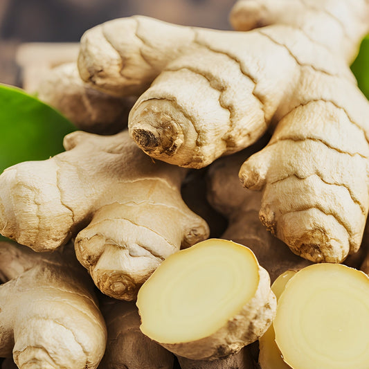 Ginger roots in a wooden box on a wooden surface