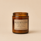 Coffee and hazelnut scented soy jar candle in amber glass with label showing Hazelnut Latte