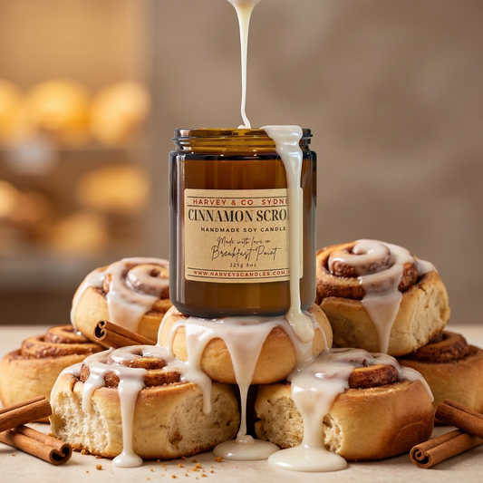 Cinnamon scroll soy candle in amber jar with hand-poured wax and melted white wax drips over the rim