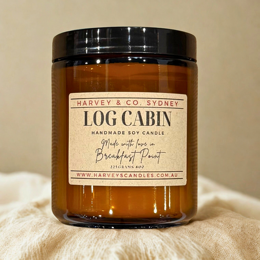 Harvey & Co. Sydney Log Cabin candle on a beige background