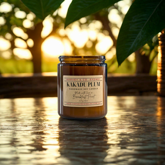 Harvey & Co. Sydney Kakadu Plum candle on a wooden surface with a blurred natural background