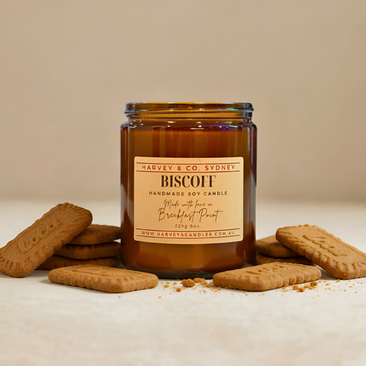 Brown candle with a label on a beige background