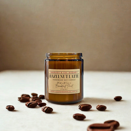 Harvey & Co. Sydney hazelnut latte candle with coffee beans on a neutral background