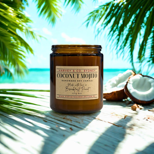 Coconut mojito candle with palm leaves and coconuts in the background