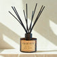 Kakadu Plum diffuser with black sticks on a light background. This is an example image of our diffuser products. 