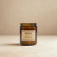 Brown glass candle labeled 'SPA DAY' on a beige background