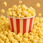 Butter popcorn soy jar candle with amber jar and hand-poured wax, shown in a striped popcorn bucket style