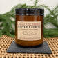 Harvey & Co. Sydney candle labeled 'Daintree Forest' on a woven surface with greenery in the background