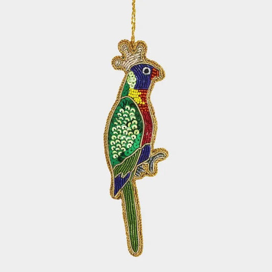 Decorative parrot ornament with colorful details on a white background